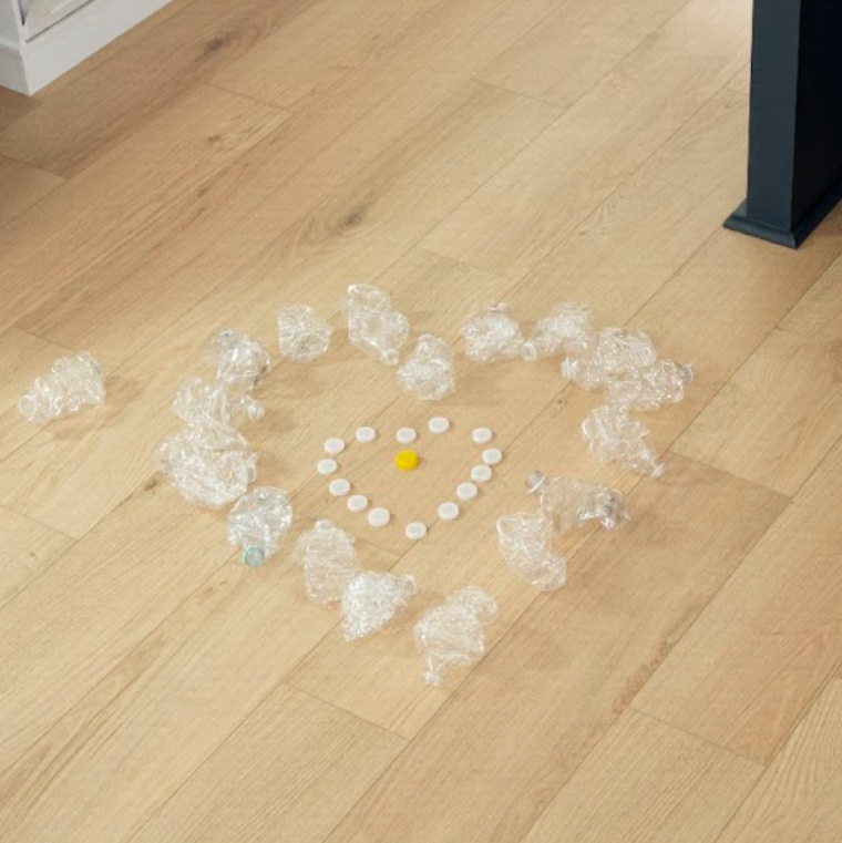 Heart design made of plastic bottles on a sustainable SolidTech R floor