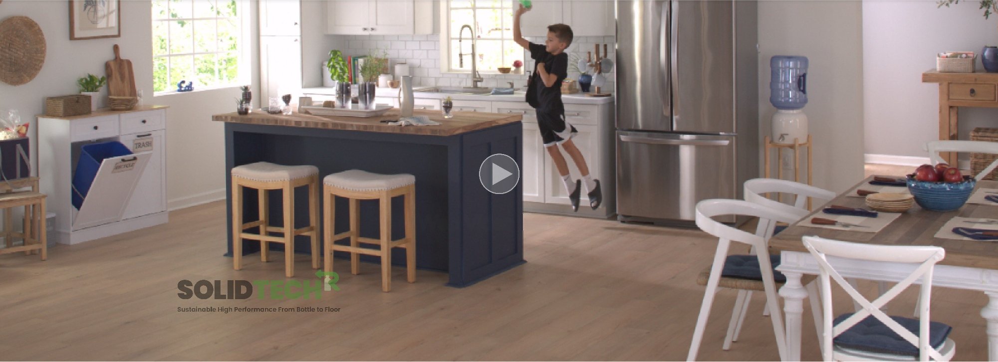 Young boy playing in a kitchen with durable SolidTech R Flooring